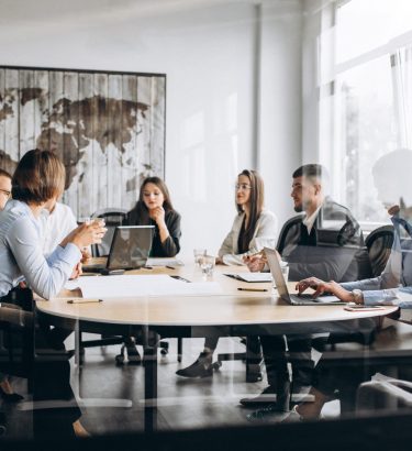 Group of people working out business plan in an office